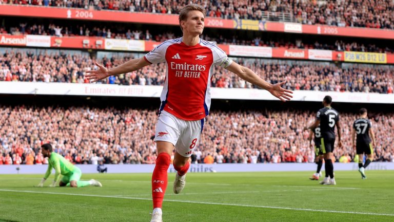 Martin Odegaard celebrates after scoring for Arsenal against Manchester City