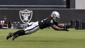 Ashton Jeanty diving for a pass in Las Vegas Raiders practice gear