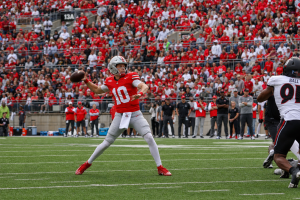 Ohio State quarterback throwing a pass at Ohio Stadium