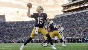 CJ Carr throwing a pass for Notre Dame, the current Heisman Trophy odds favorite