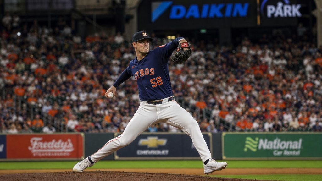 Hunter Brown pitching in mid-windup delivery for the Houston Astros