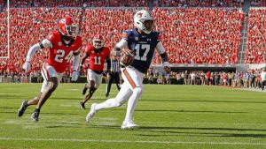 Auburn quarterback Byrum Brown running the ball against Georgia at Sanford Stadium