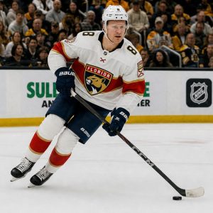Brady Tkachuk skating with the puck for the Florida Panthers in his road jersey