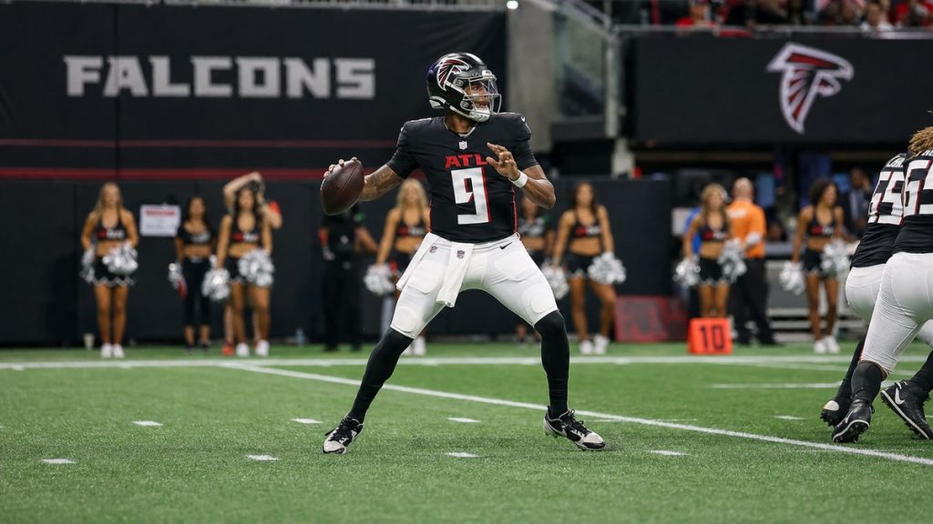 Atlanta Falcons quarterback Michael Penix Jr. dropping back to pass at Mercedes-Benz Stadium