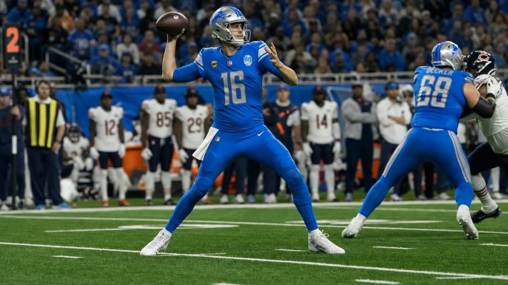 Jared Goff throwing a pass for the Detroit Lions at Ford Field