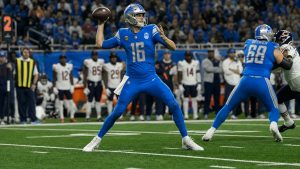 Jared Goff throwing a pass for the Detroit Lions at Ford Field