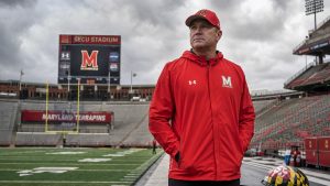 Maryland Terrapins head coach standing alone on the sideline at SECU Stadium after Mike Locksley's firing
