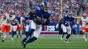 Najee Harris carrying the football for the New York Giants