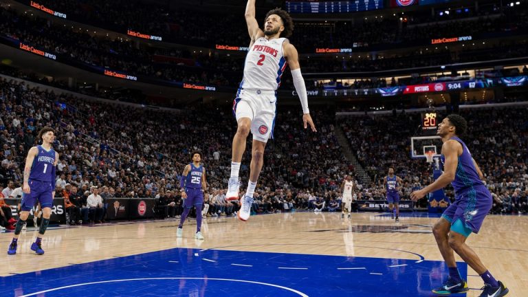 Cade Cunningham of the Detroit Pistons driving to the basket on NBA opening day at Little Caesars Arena
