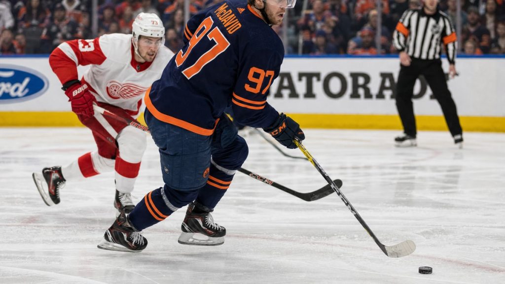 Connor McDavid of the Edmonton Oilers carrying the puck at Rogers Place against the Detroit Red Wings