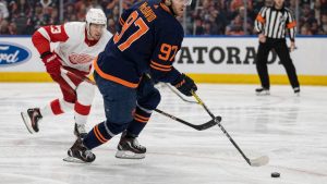 Connor McDavid of the Edmonton Oilers carrying the puck at Rogers Place against the Detroit Red Wings